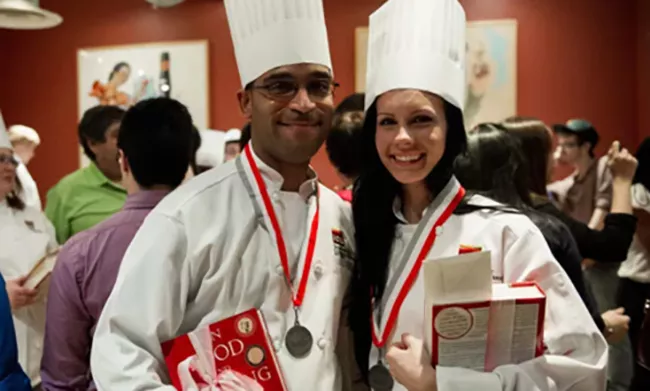 Two Alumni of the Institute of Culinary Education Standing Together